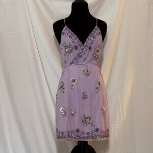 Women’s elegant purple, knee-length dress